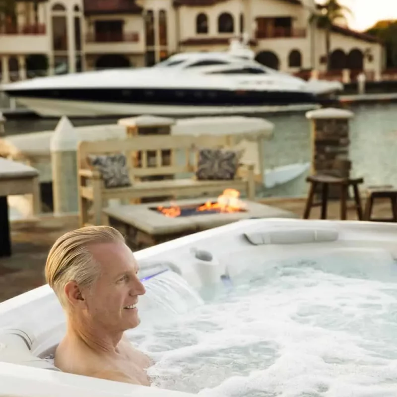 Man Enjoys Time In A Hot Tub From Sundance Spas